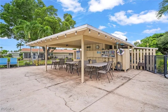 a patio with table and chairs