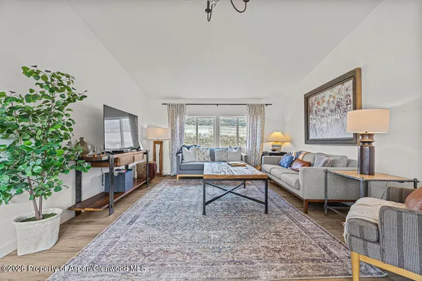 a living room with furniture and a window