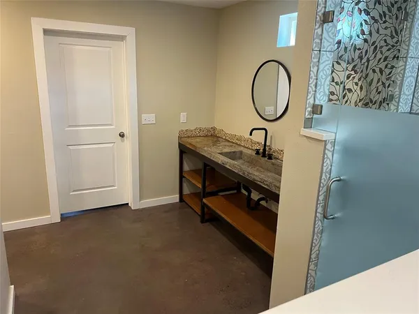 a room with a table and a mirror