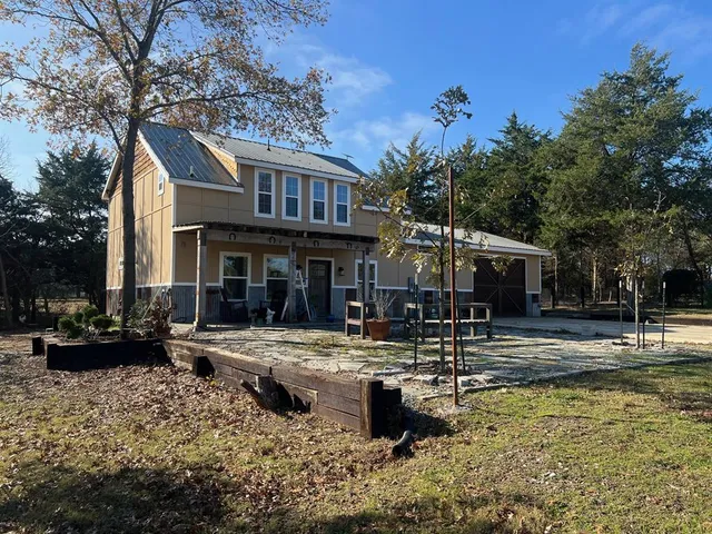 a swimming pool view with a seating space