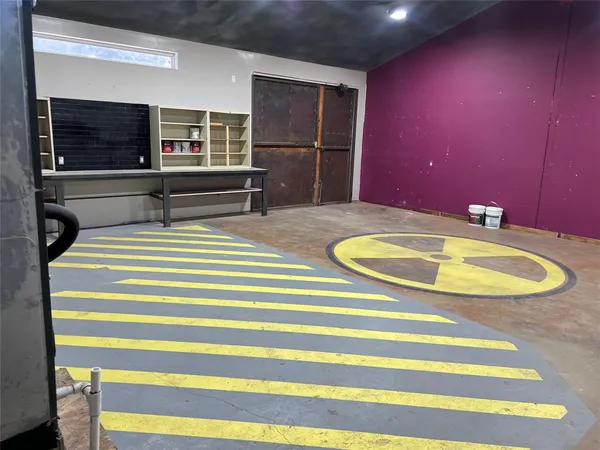 a view of a room with wooden floor and windows
