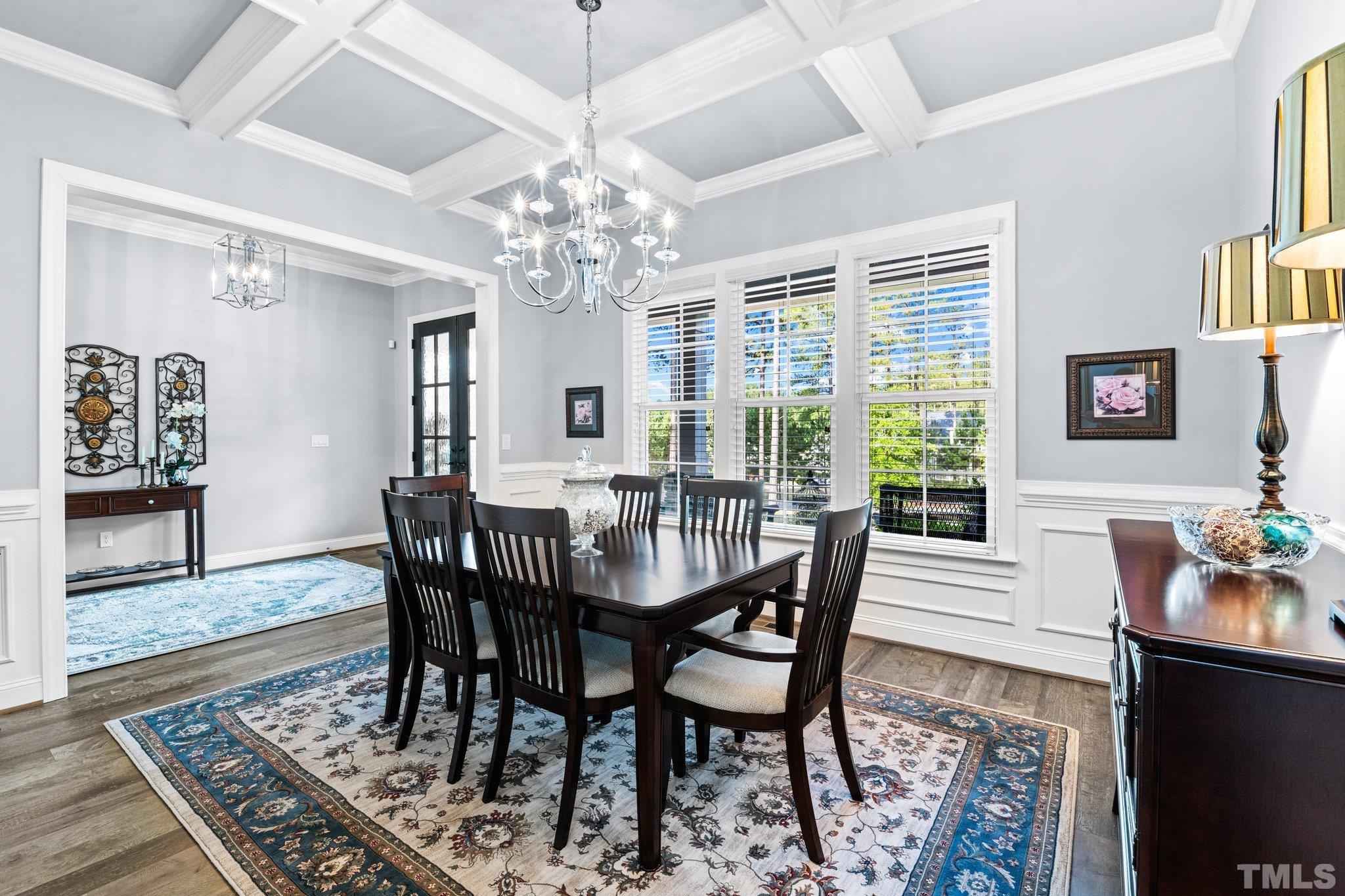 384 Colonial Ridge Drive Pittsboro, NC 27312 - Photo 11 of 47 a view of a dining room with furniture window and wooden floor