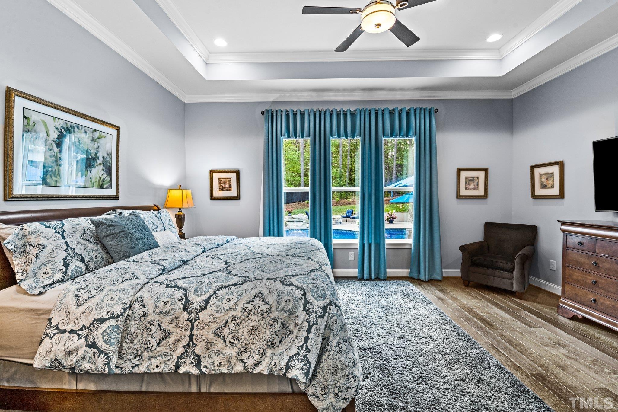 384 Colonial Ridge Drive Pittsboro, NC 27312 - Photo 12 of 47 a bedroom with a bed dresser and a window