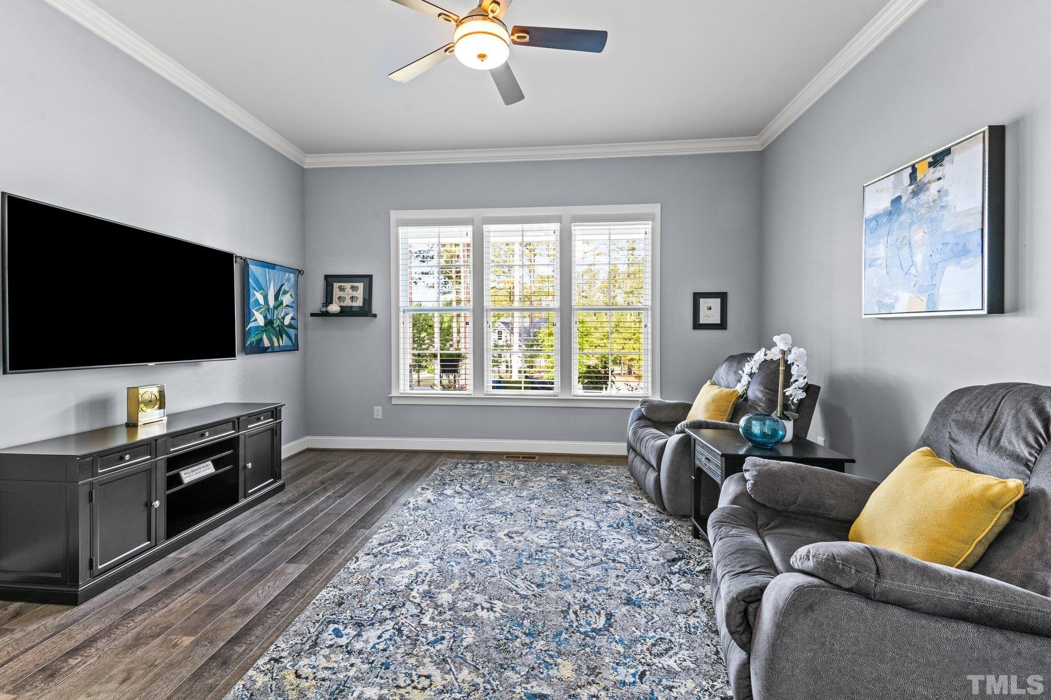 384 Colonial Ridge Drive Pittsboro, NC 27312 - Photo 18 of 47 a living room with furniture and a flat screen tv