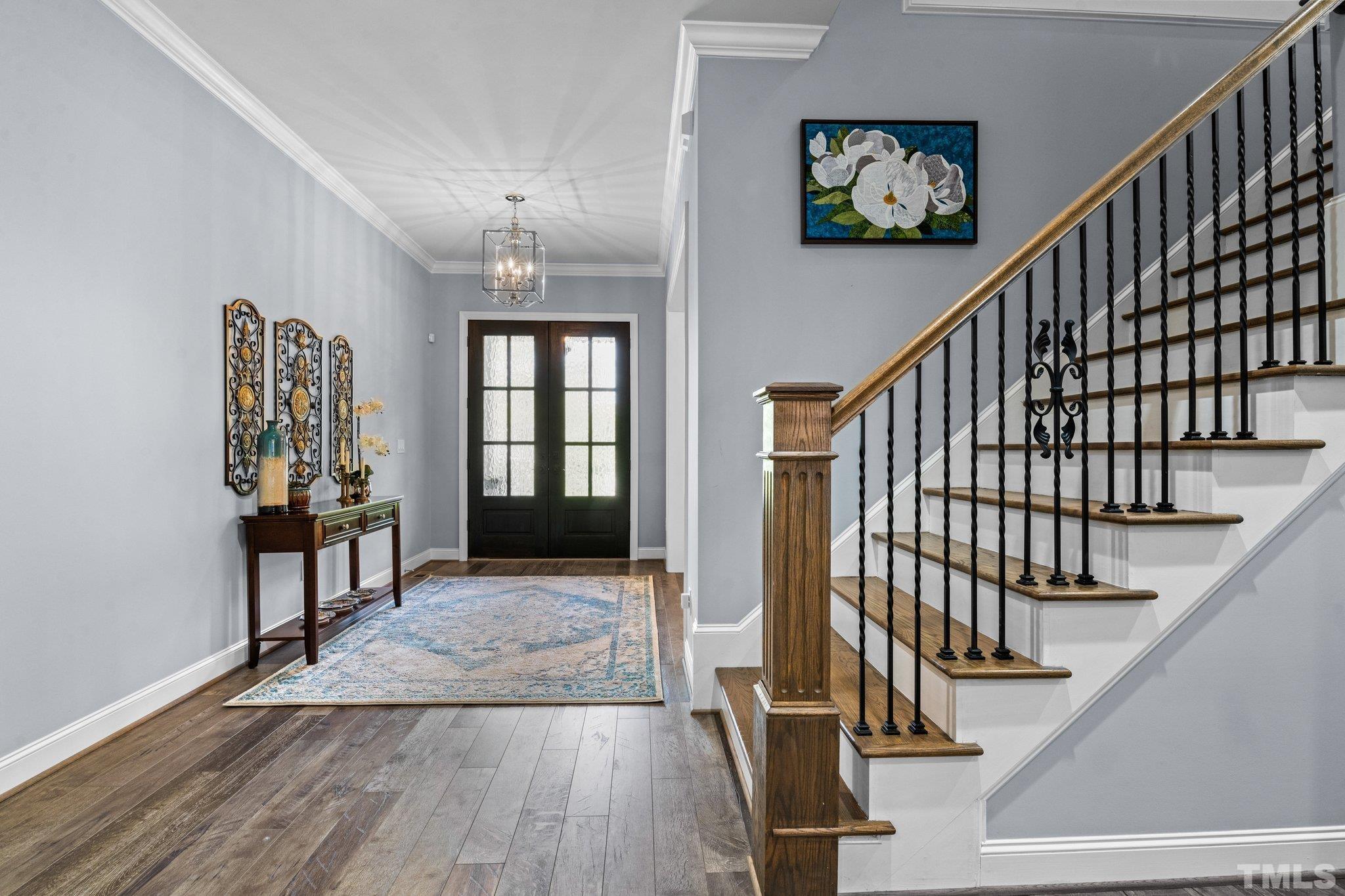 384 Colonial Ridge Drive Pittsboro, NC 27312 - Photo 22 of 47 a view of entryway and hall with wooden floor