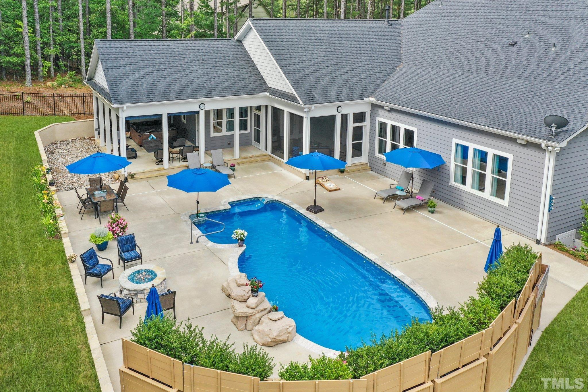 384 Colonial Ridge Drive Pittsboro, NC 27312 - Photo 26 of 47 a view of a house with pool and chairs