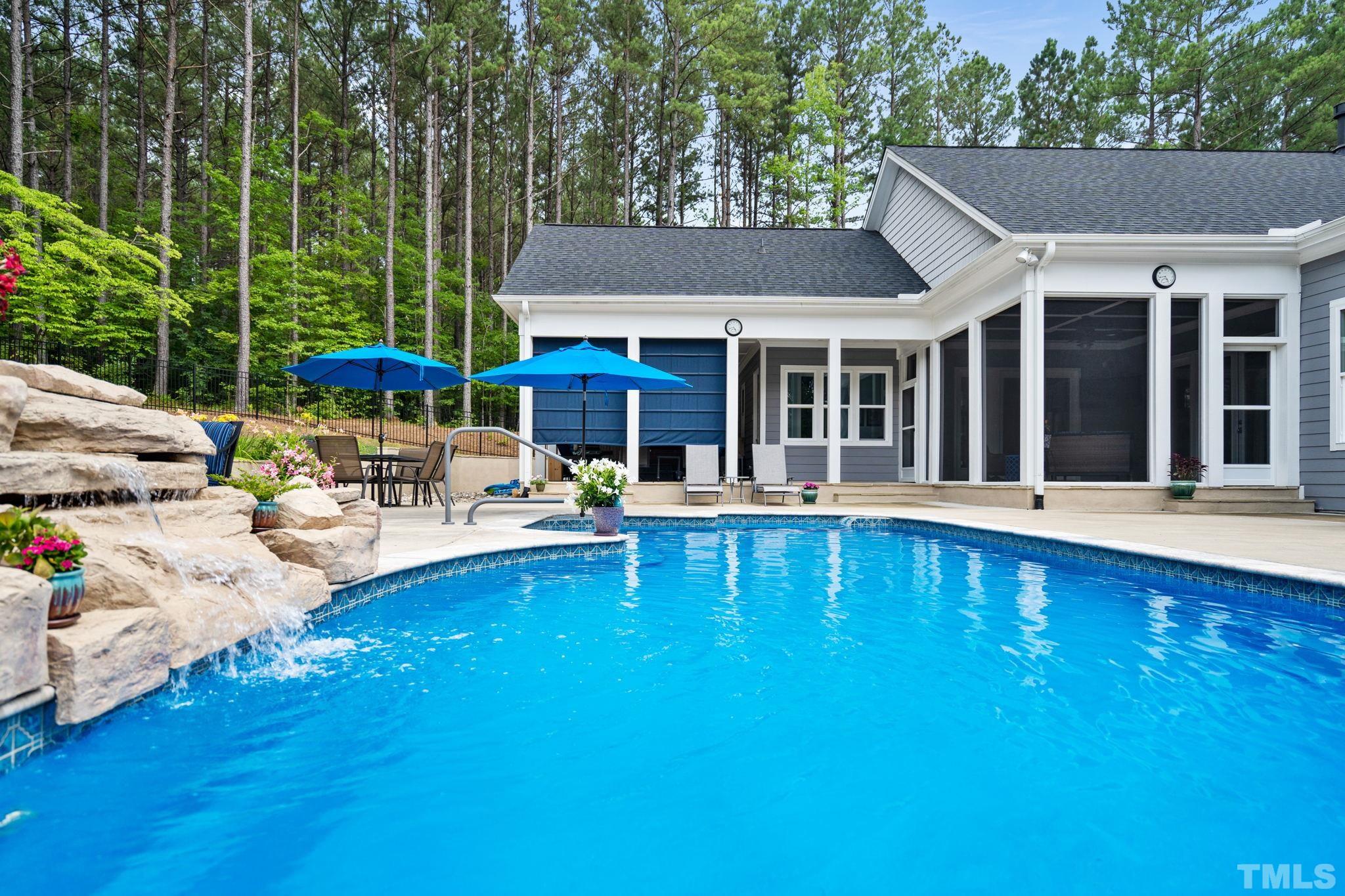 384 Colonial Ridge Drive Pittsboro, NC 27312 - Photo 28 of 47 a view of a swimming pool with lounge chairs