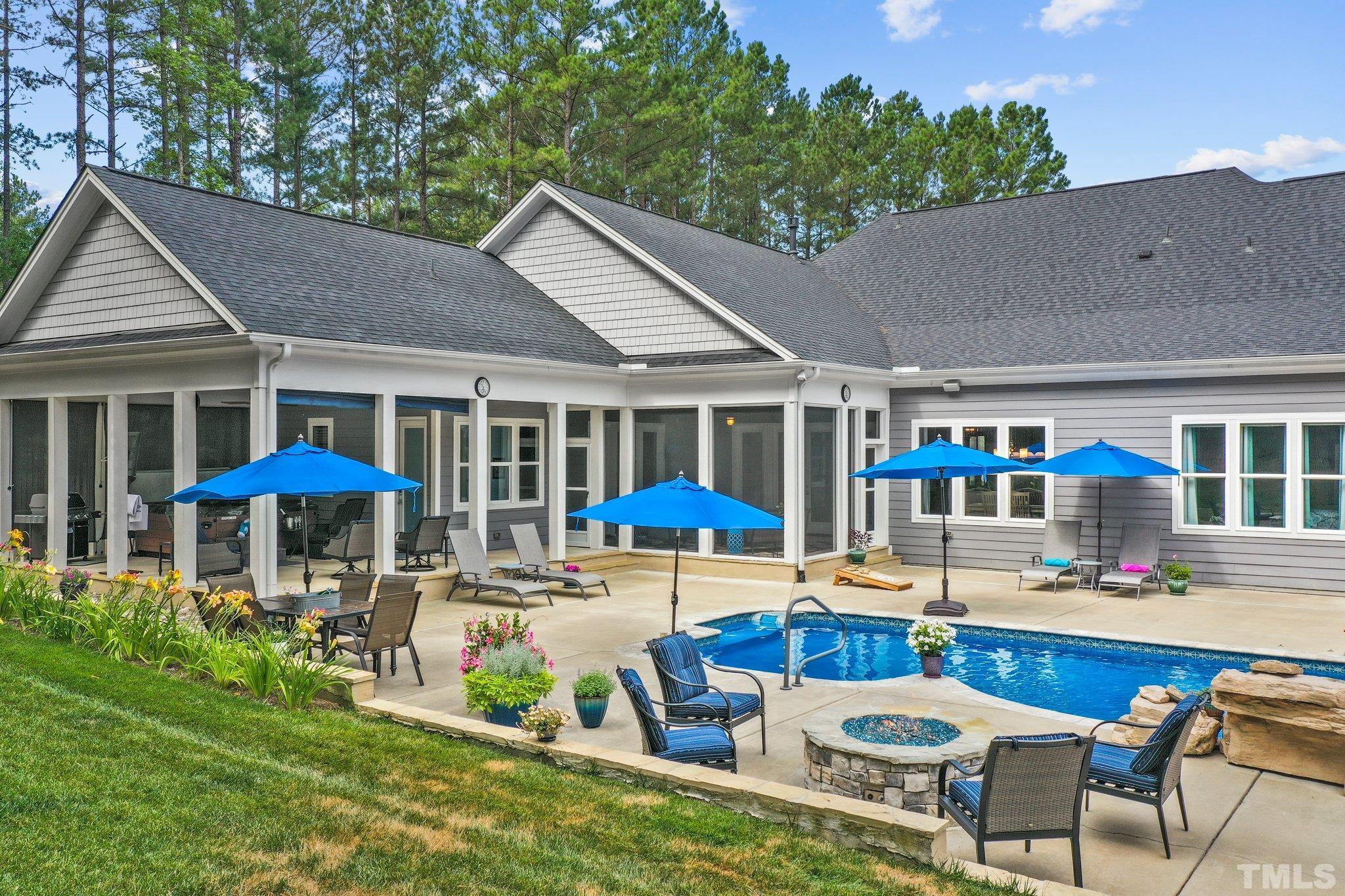 384 Colonial Ridge Drive Pittsboro, NC 27312 - Photo 33 of 47 a view of a house with pool and chairs