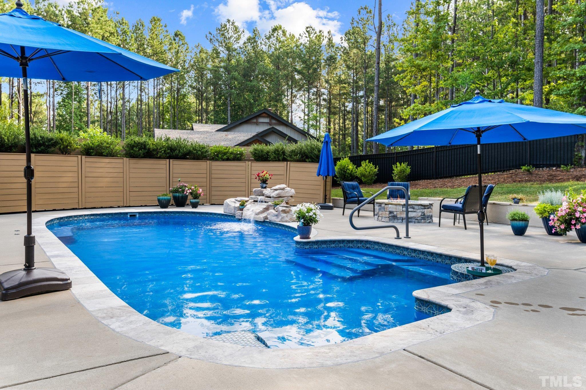 384 Colonial Ridge Drive Pittsboro, NC 27312 - Photo 34 of 47 a view of a swimming pool with a patio