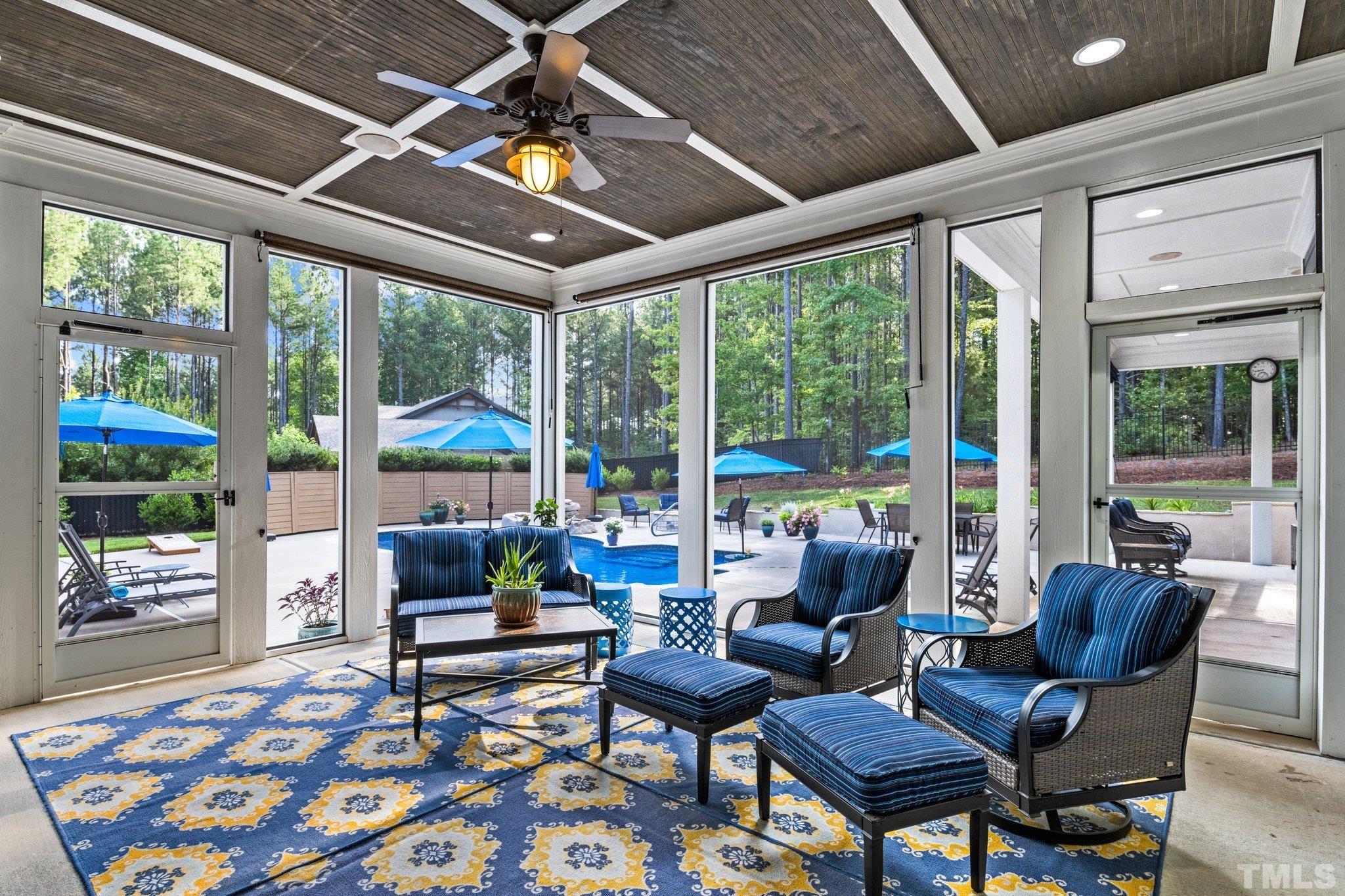 384 Colonial Ridge Drive Pittsboro, NC 27312 - Photo 38 of 47 a living room with furniture and a floor to ceiling window
