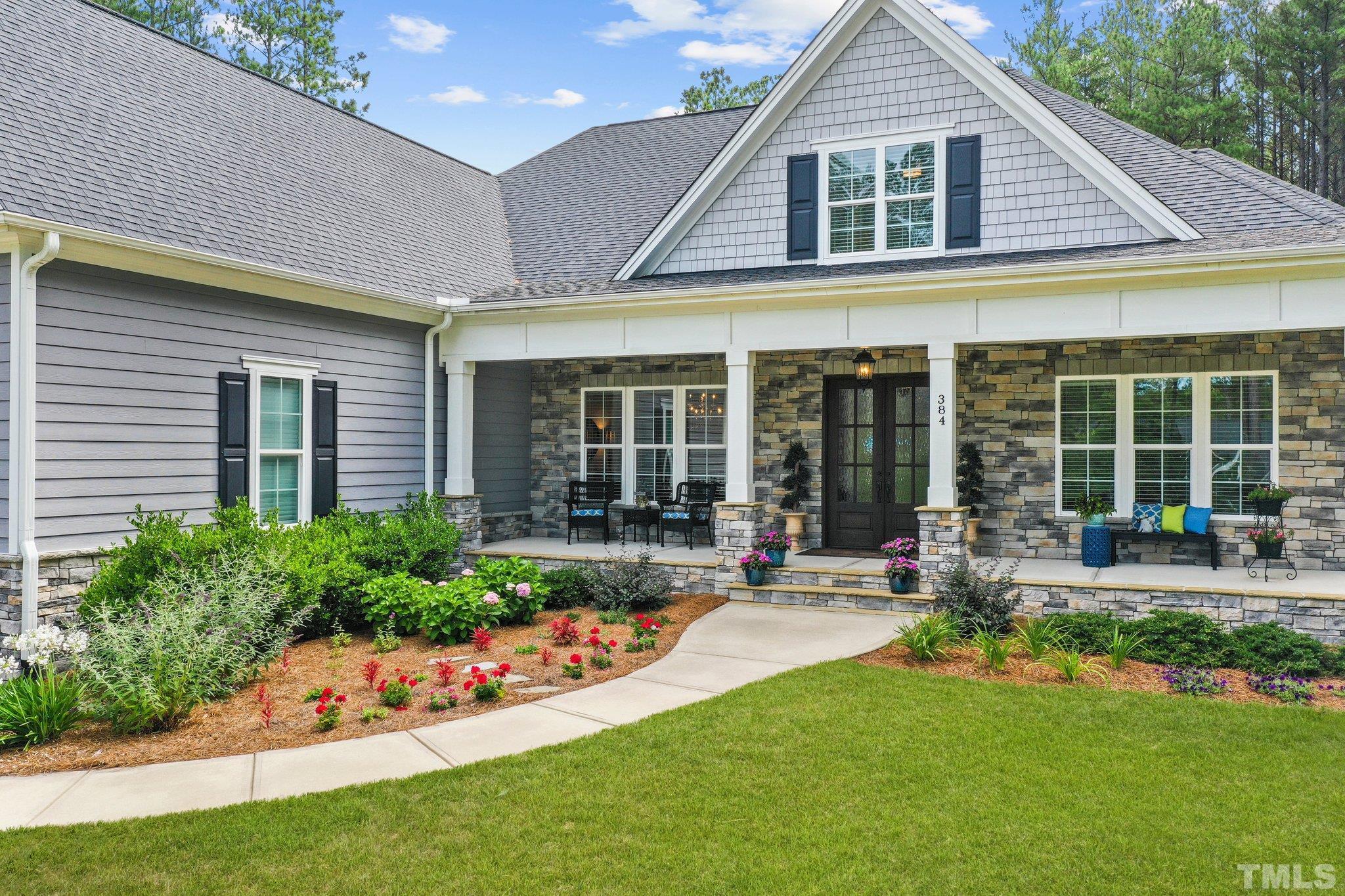 384 Colonial Ridge Drive Pittsboro, NC 27312 - Photo 39 of 47 a front view of house with yard and outdoor seating