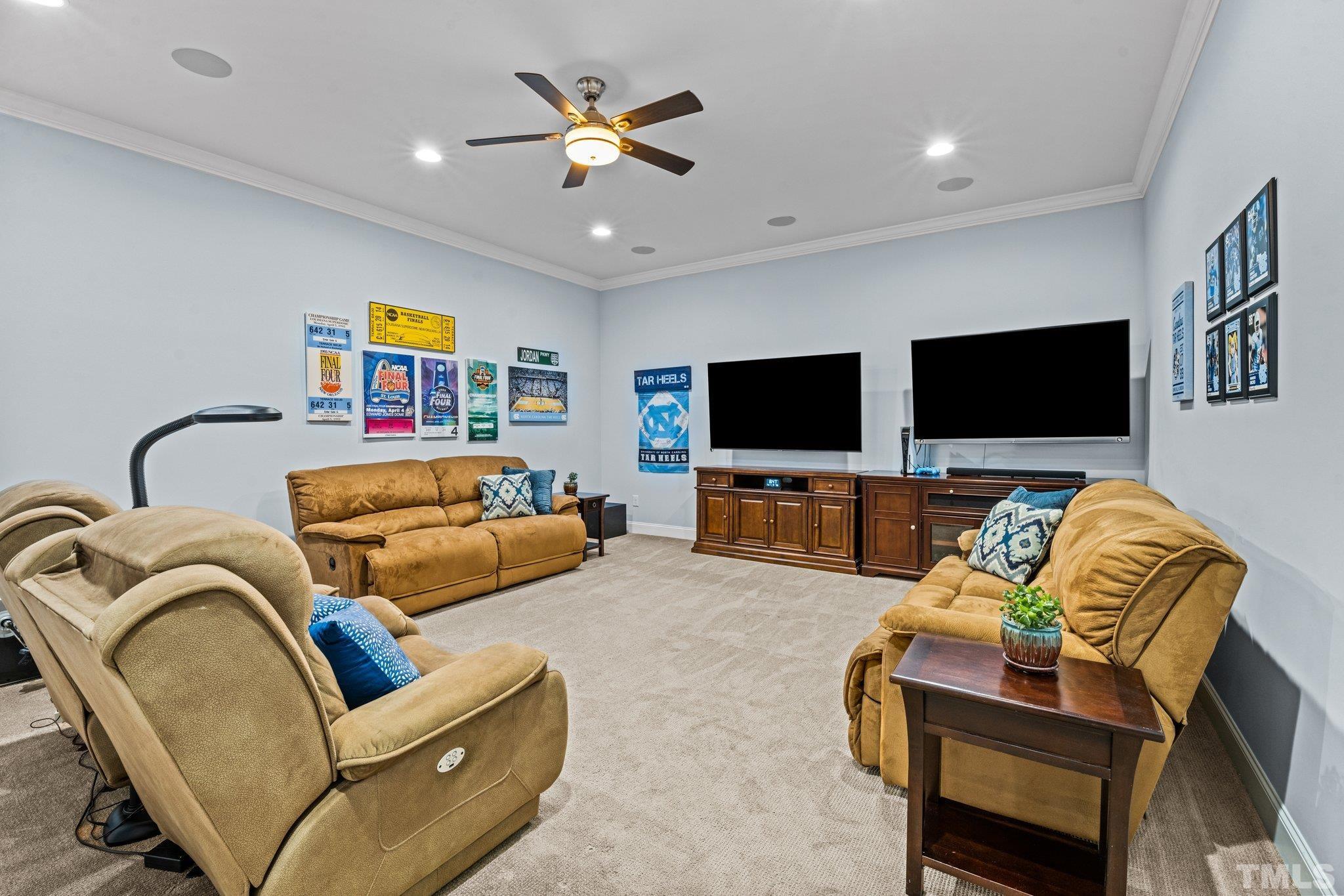 384 Colonial Ridge Drive Pittsboro, NC 27312 - Photo 47 of 47 a living room with furniture and a flat screen tv