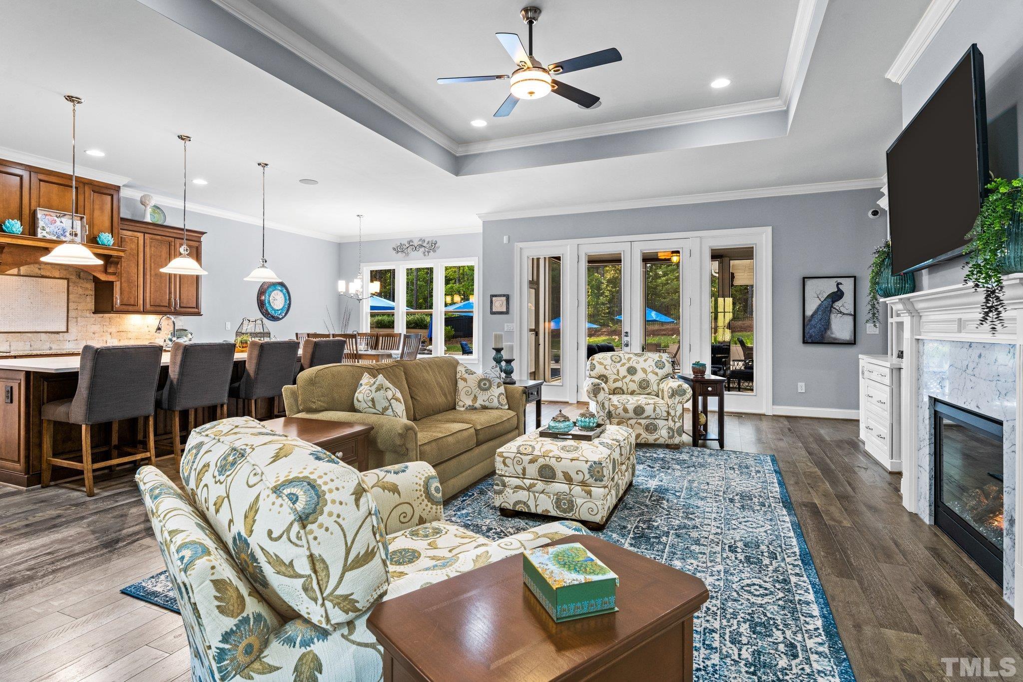 384 Colonial Ridge Drive Pittsboro, NC 27312 - Photo 5 of 47 a living room with fireplace furniture and a flat screen tv