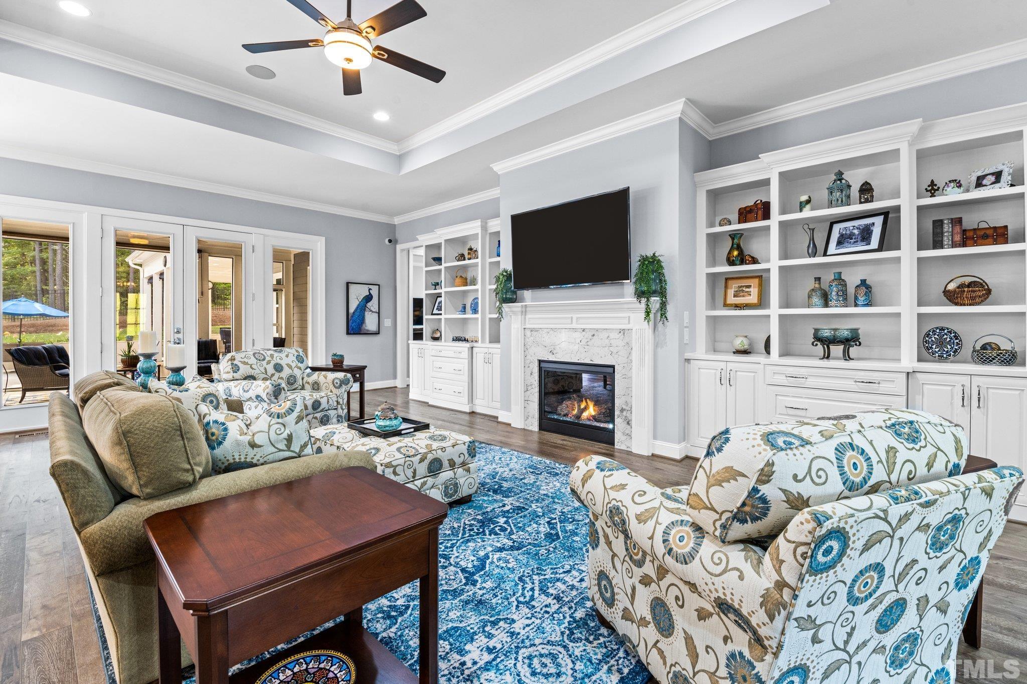 384 Colonial Ridge Drive Pittsboro, NC 27312 - Photo 6 of 47 a living room with furniture fireplace and a flat screen tv