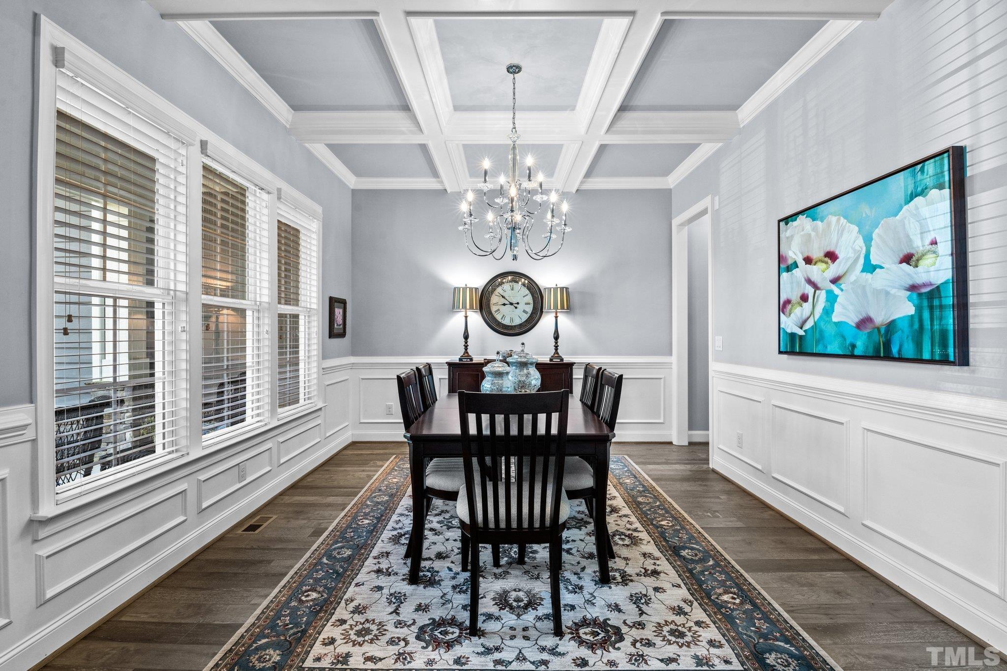 384 Colonial Ridge Drive Pittsboro, NC 27312 - Photo 10 of 47 a view of a dining room with furniture a rug and wooden floor