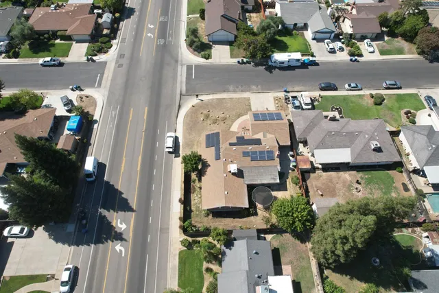 an aerial view of residential houses with outdoor space