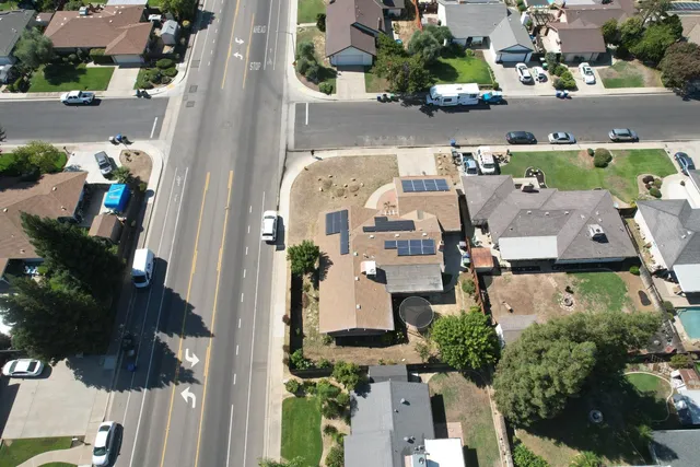 an aerial view of residential houses with outdoor space