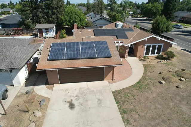 an aerial view of a house with swimming pool