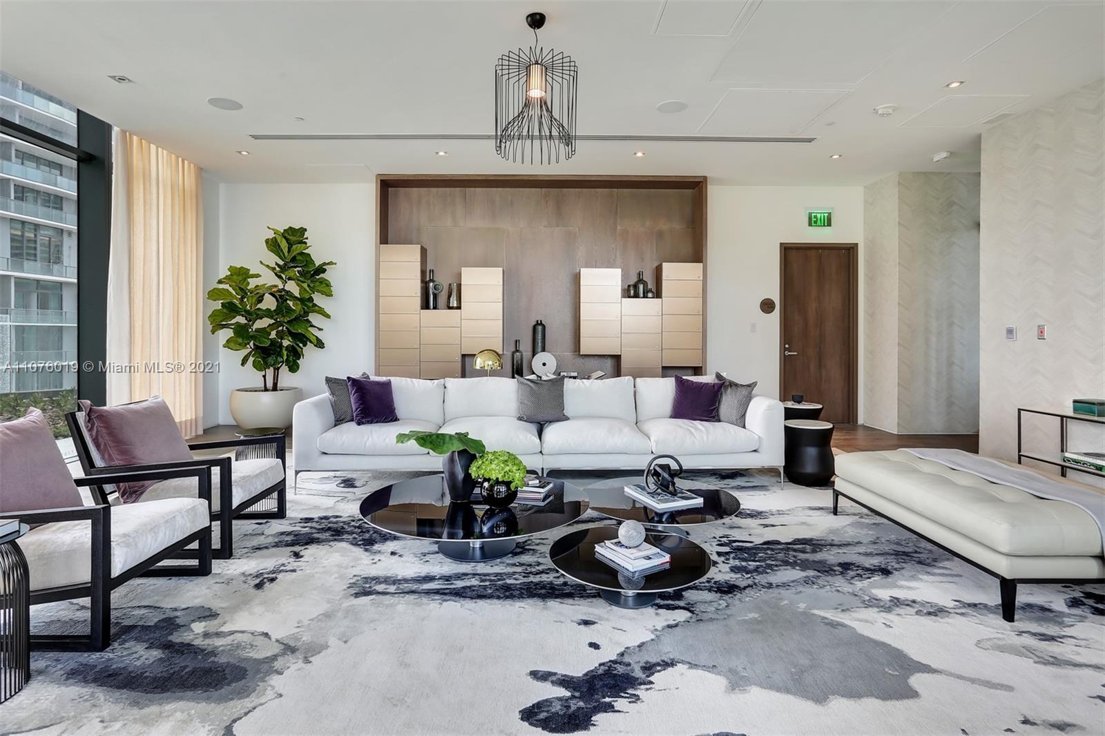 650 Northeast 32nd Street, Unit 4103 Miami, FL 33137 - Photo 31 of 44 a living room with furniture and a chandelier