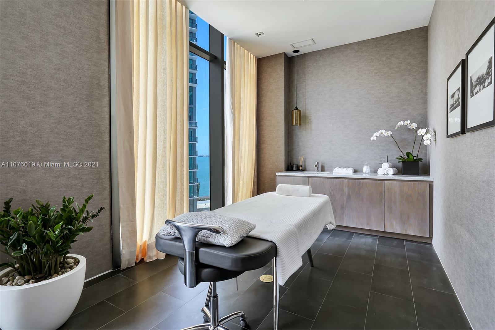 650 Northeast 32nd Street, Unit 4103 Miami, FL 33137 - Photo 36 of 44 a dining room with furniture and wooden floor