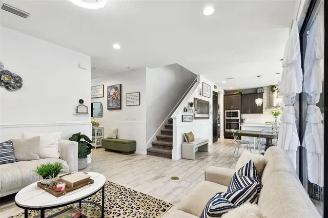 a living room with furniture and flat screen tv