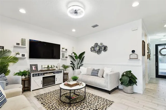 a kitchen with kitchen island granite countertop a sink counter top space and stainless steel appliances