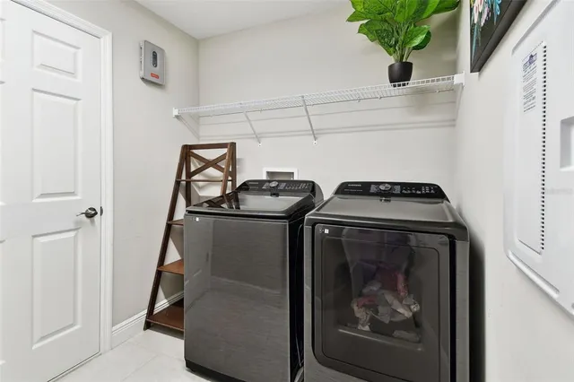 a view of a swimming pool with a table and chairs