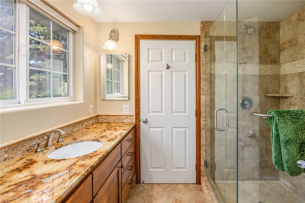 1134 Scenic Way Rimforest, CA 92378 - Photo 22 of 37 Gorgeous Bathroom with Beautiful Stone Countertop and Large Walk-in Shower