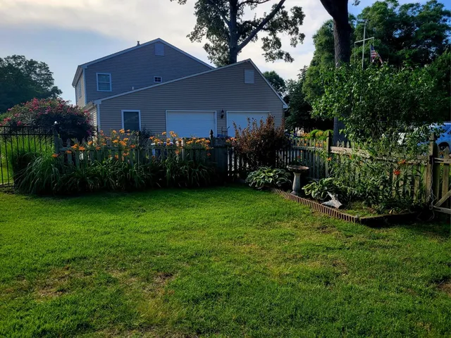 a view of a back yard of the house