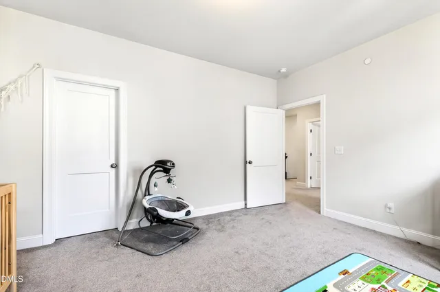 a room with gym equipment and a window