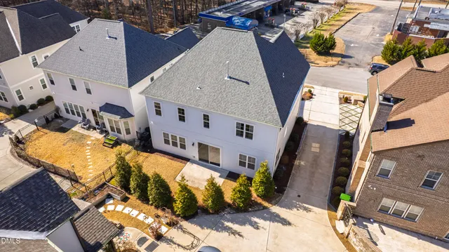 an aerial view of residential houses with outdoor space