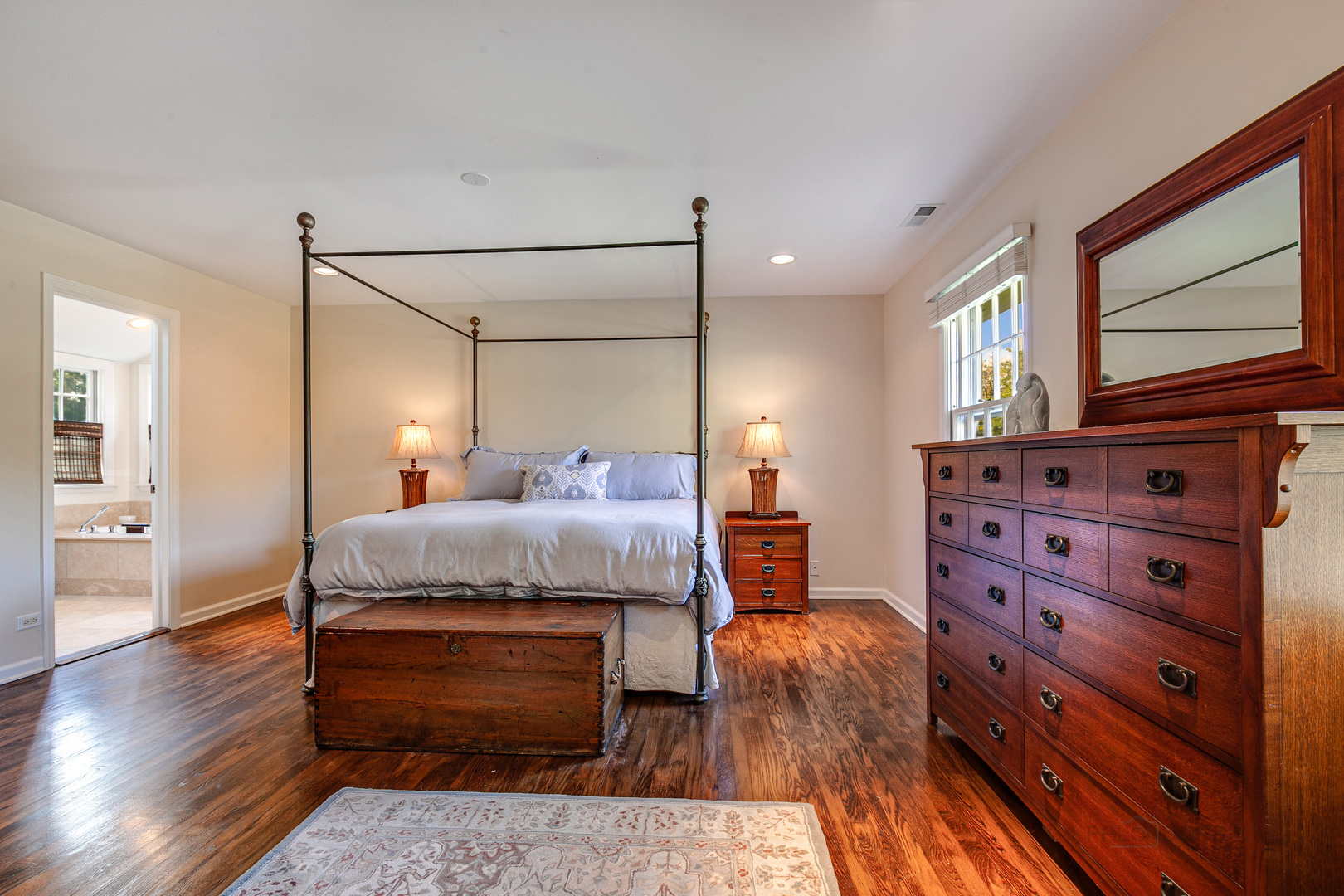 1267 West Deerpath Road Lake Forest, IL 60045 - Photo 18 of 47 a spacious bedroom with a bed and wooden floor