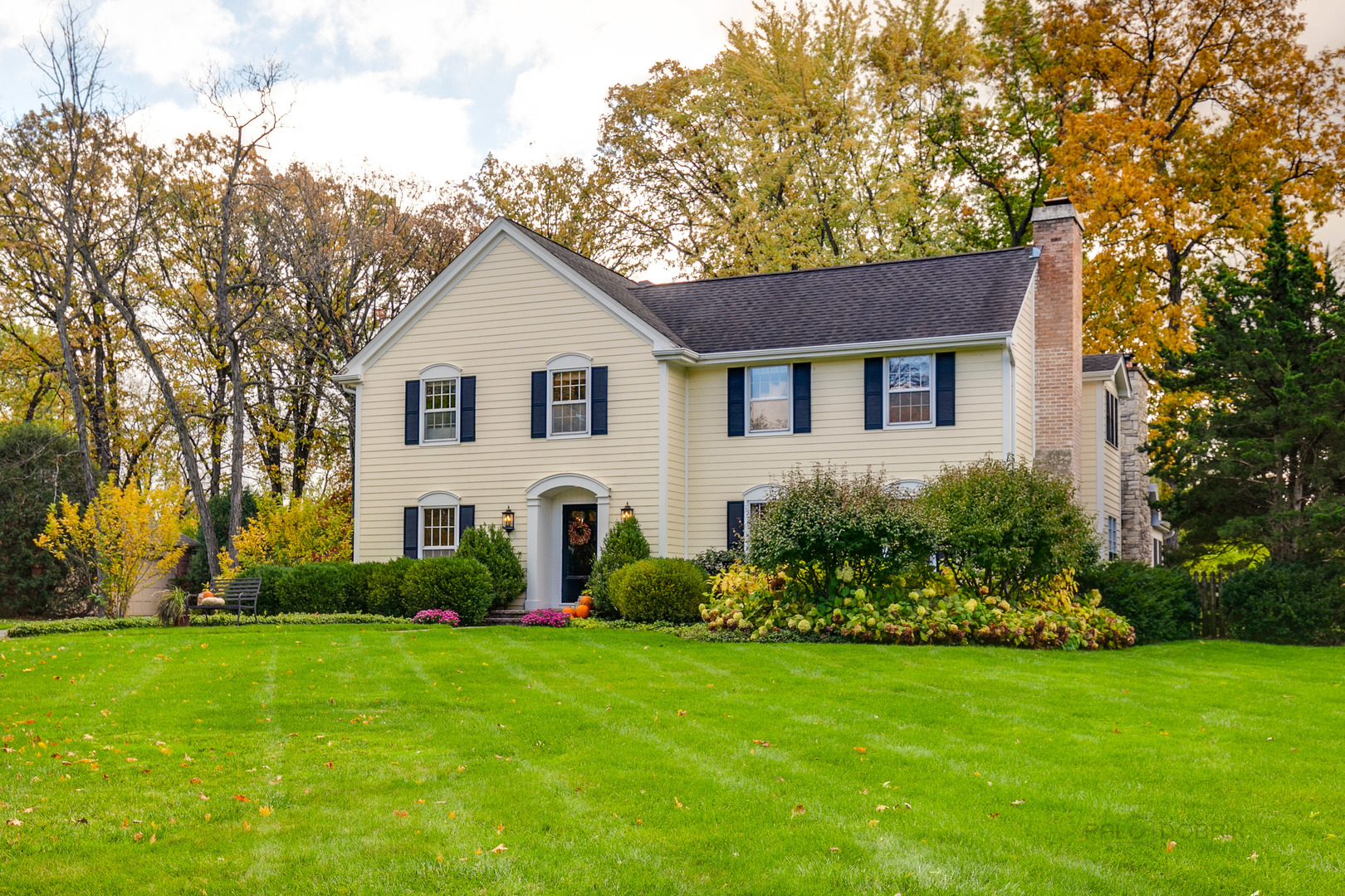 1267 West Deerpath Road Lake Forest, IL 60045 - Photo 2 of 47 a front view of a house with a garden