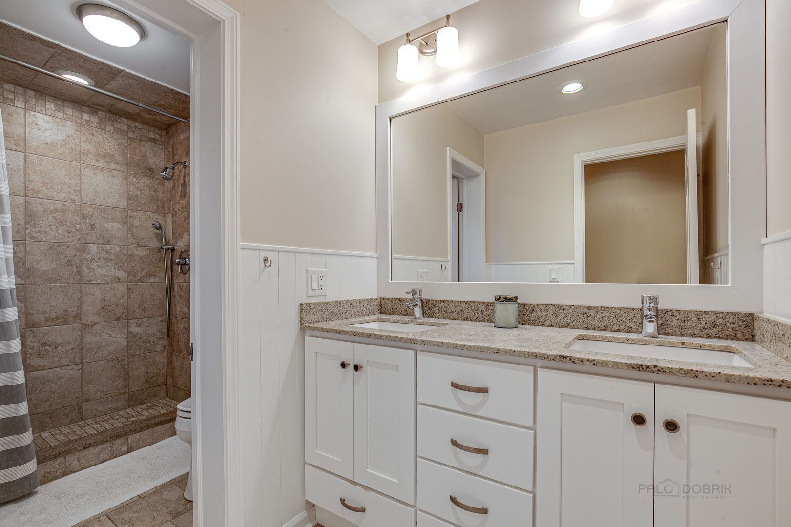 1267 West Deerpath Road Lake Forest, IL 60045 - Photo 25 of 47 a bathroom with a granite countertop sink mirror and double