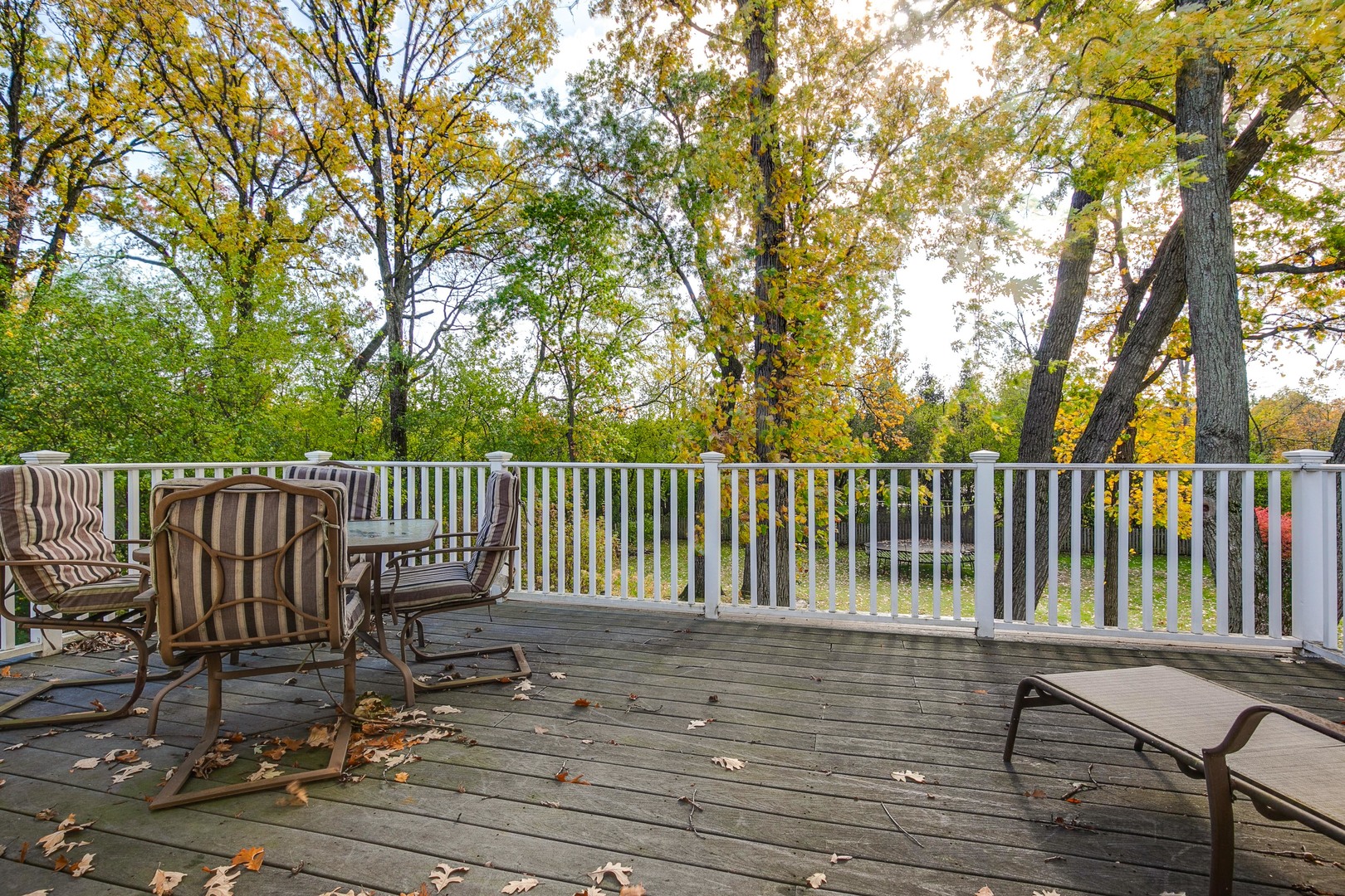 1267 West Deerpath Road Lake Forest, IL 60045 - Photo 27 of 47 a view of a deck with a chair and wooden floor