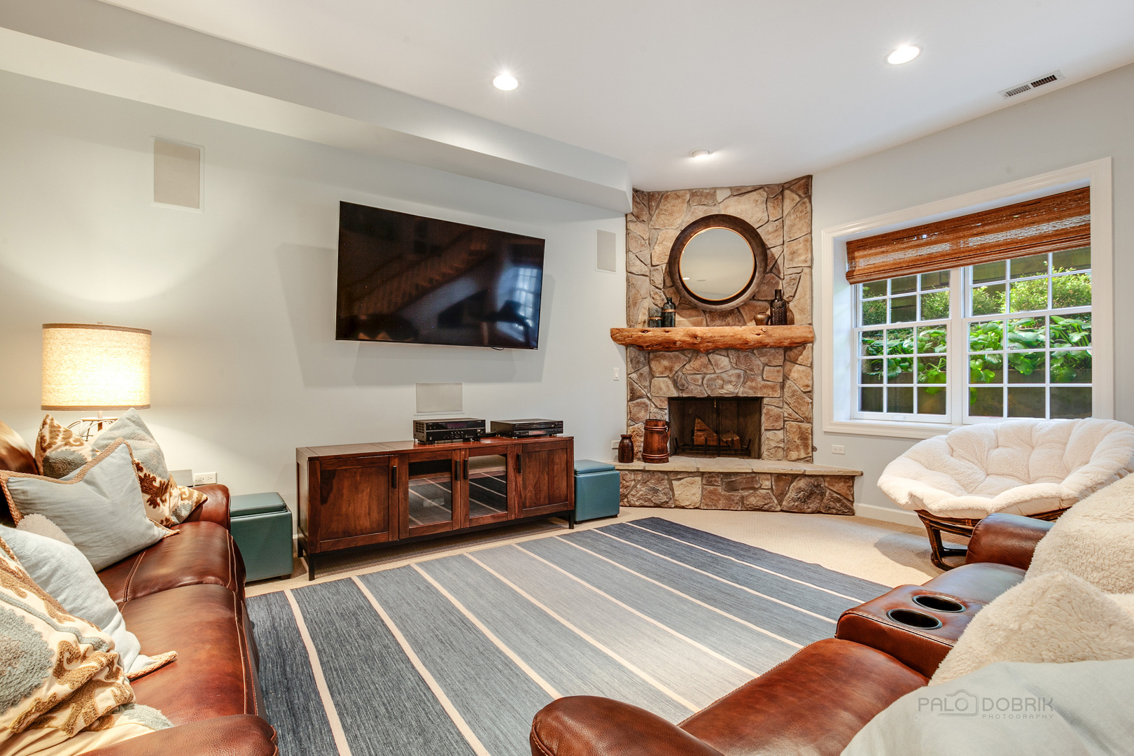 1267 West Deerpath Road Lake Forest, IL 60045 - Photo 31 of 47 a living room with furniture a fireplace and a flat screen tv