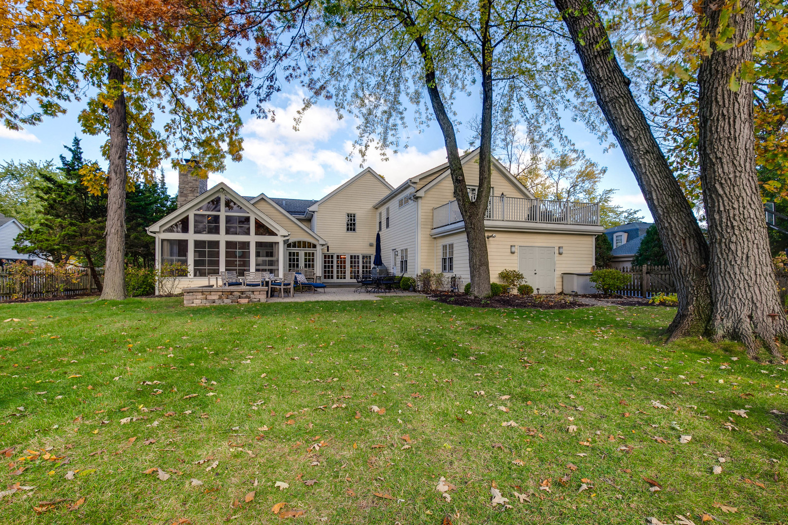 1267 West Deerpath Road Lake Forest, IL 60045 - Photo 44 of 47 a view of a house with a big yard and large trees
