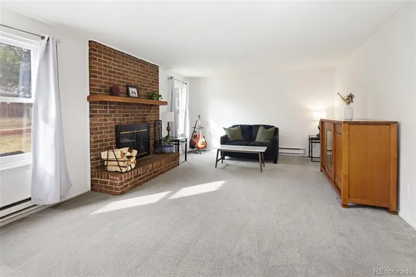 a livingroom with furniture and a flat screen tv