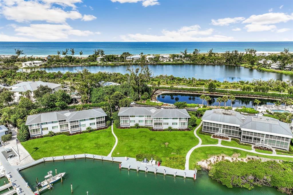 5852 Gasparilla Road, Unit MV13 Boca Grande, FL 33921 - Photo 13 of 37 a view of a lake with a big yard