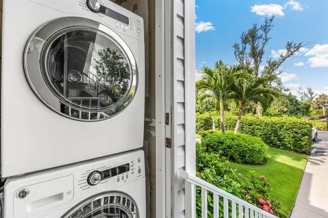 a view of a hallway with washer and dryer