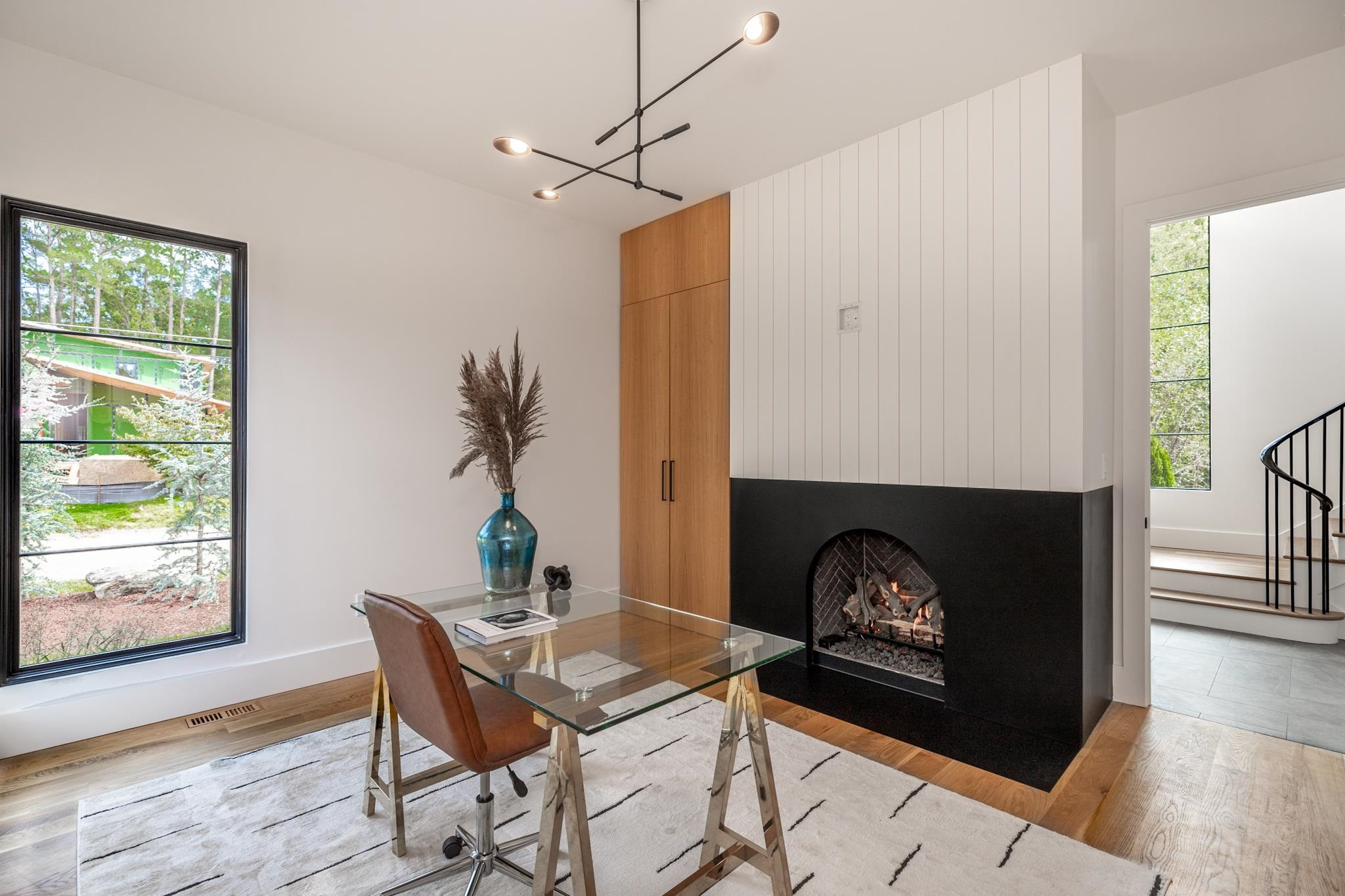 807 Chamberlain Street Raleigh, NC 27607 - Photo 12 of 40 a living room with furniture and a fireplace