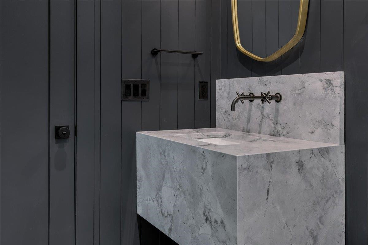 807 Chamberlain Street Raleigh, NC 27607 - Photo 17 of 40 a view of bathroom with a sink and mirror