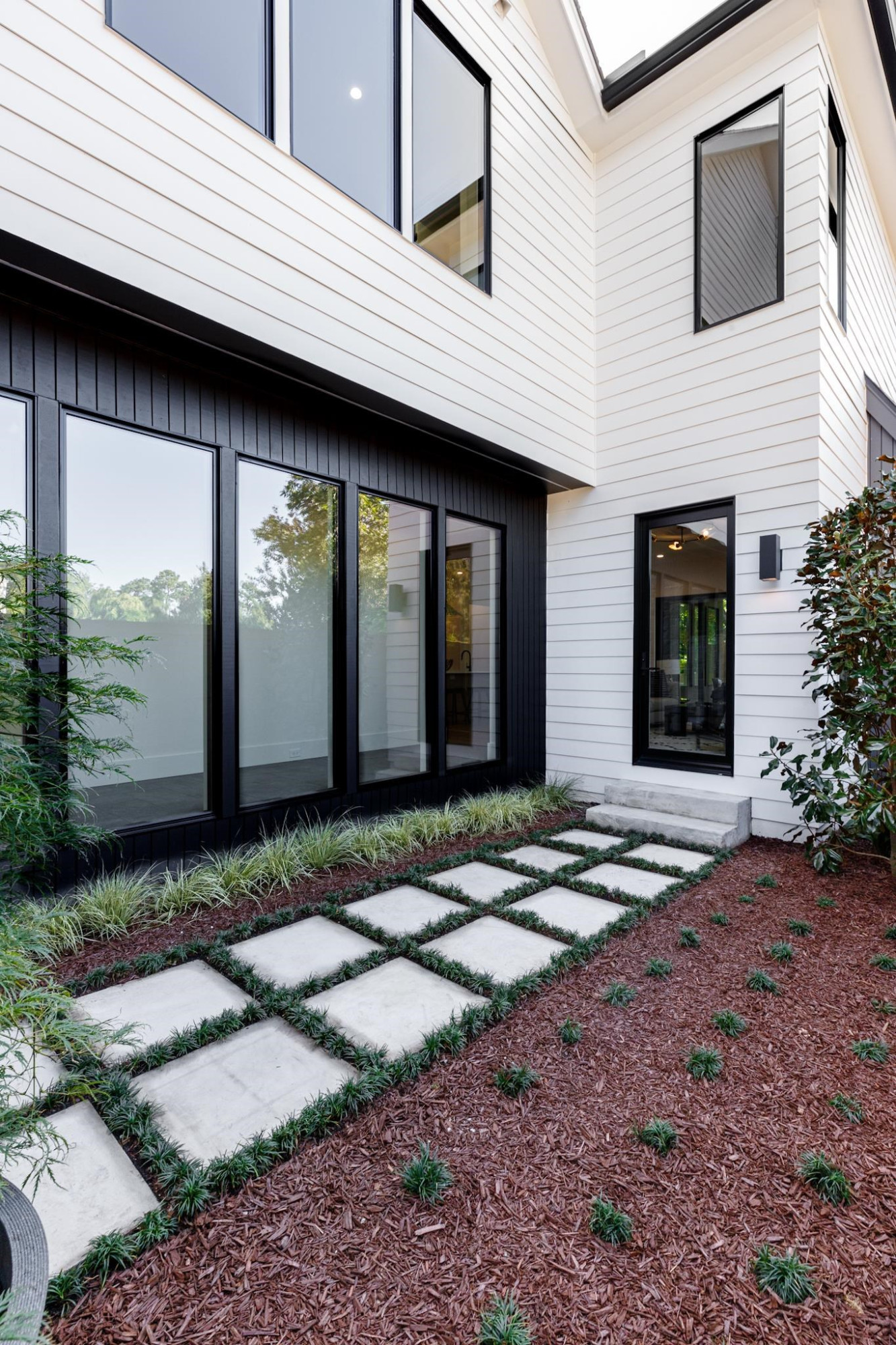 807 Chamberlain Street Raleigh, NC 27607 - Photo 22 of 40 a view of a house with backyard and windows