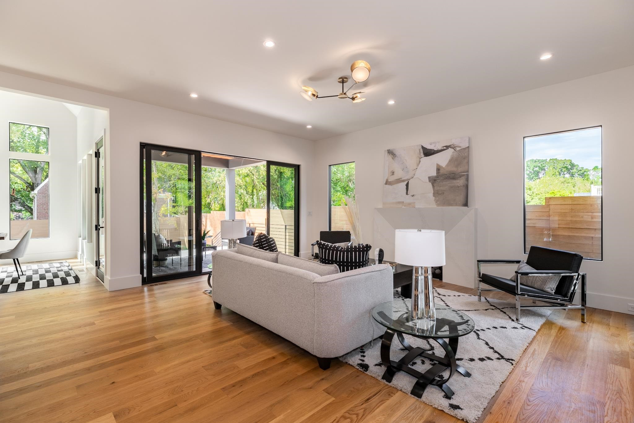 807 Chamberlain Street Raleigh, NC 27607 - Photo 23 of 40 a living room with furniture and wooden floor