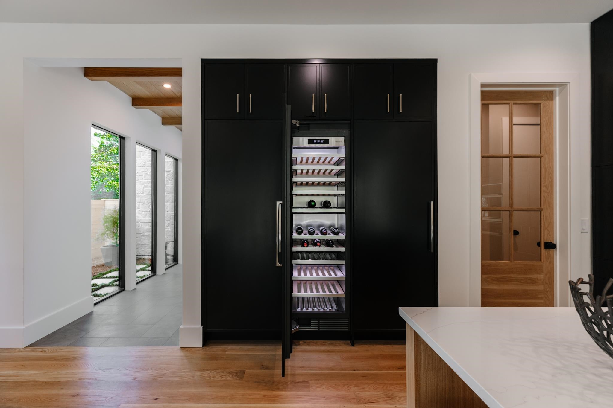 807 Chamberlain Street Raleigh, NC 27607 - Photo 28 of 40 a view of a hallway with wooden floor and windows