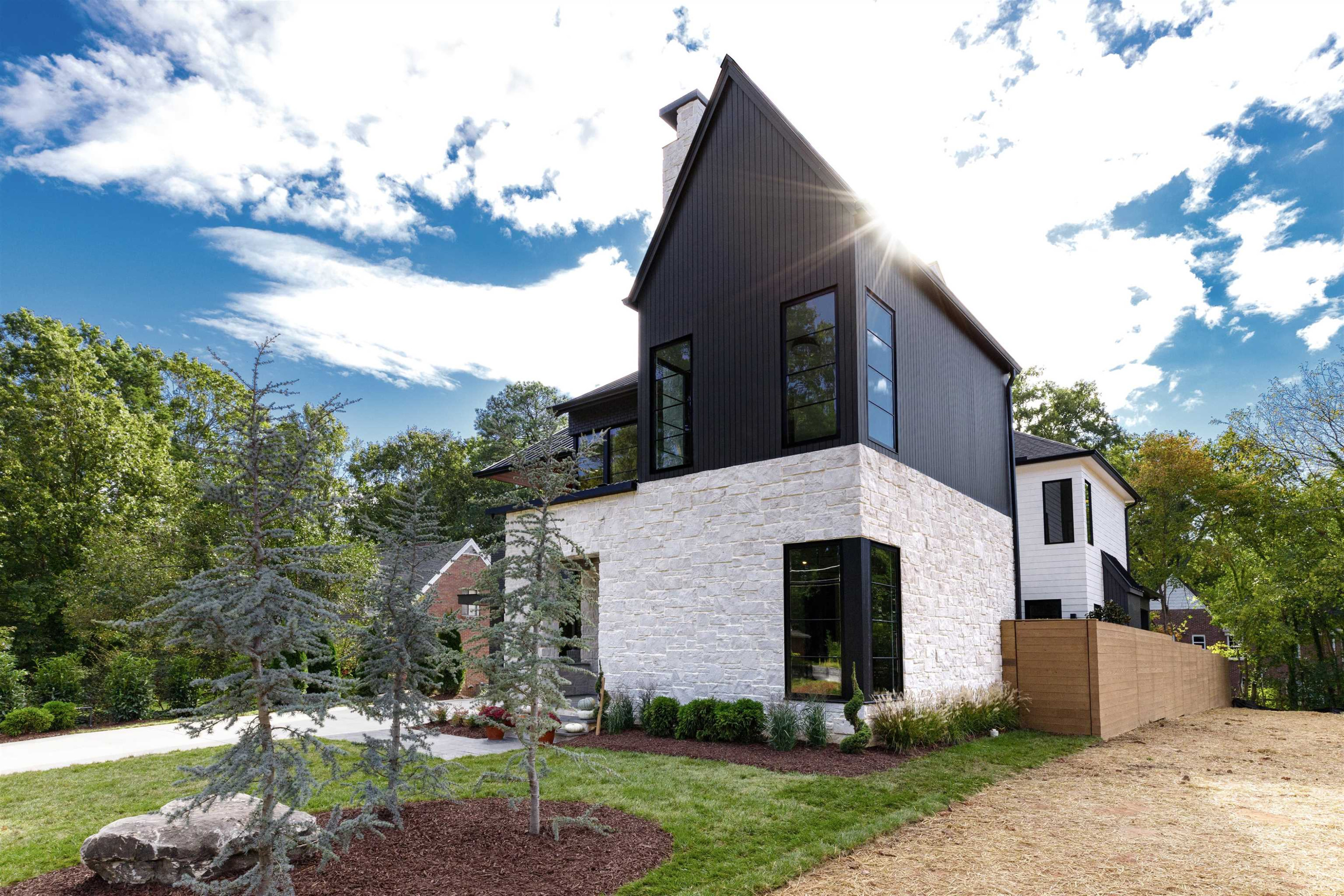 807 Chamberlain Street Raleigh, NC 27607 - Photo 3 of 40 a front view of a house with garden