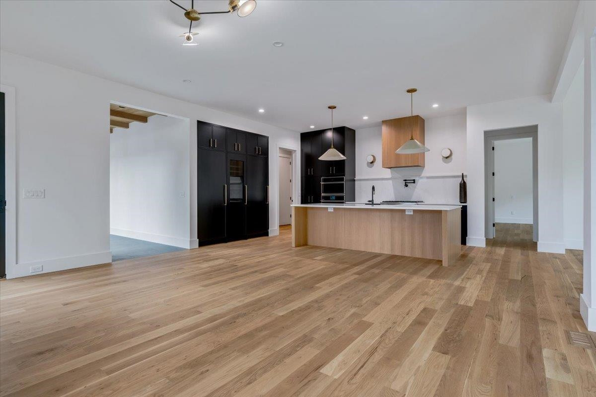 807 Chamberlain Street Raleigh, NC 27607 - Photo 32 of 40 a view of a kitchen with a sink and a refrigerator