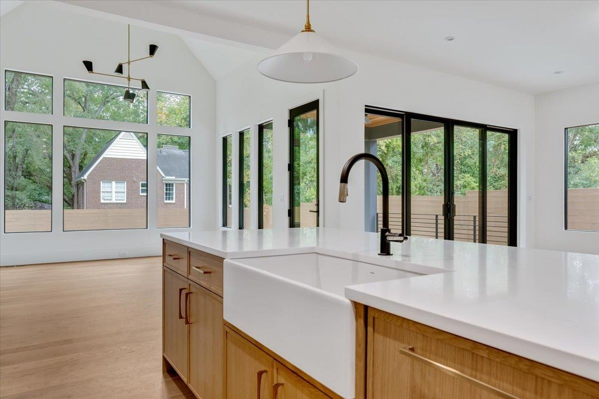 807 Chamberlain Street Raleigh, NC 27607 - Photo 38 of 40 a kitchen with a sink and a large window