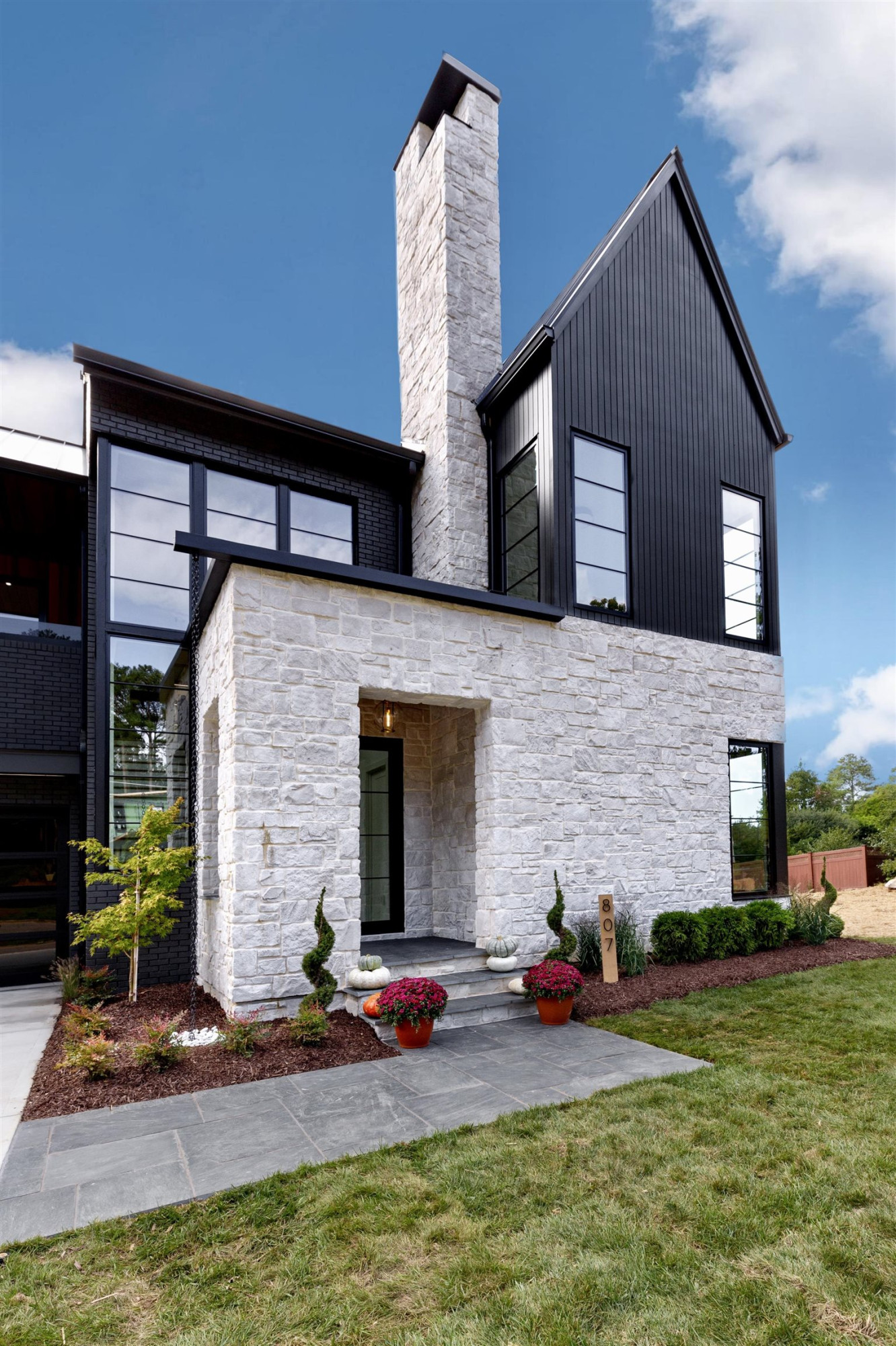 807 Chamberlain Street Raleigh, NC 27607 - Photo 4 of 40 a front view of a house with a yard