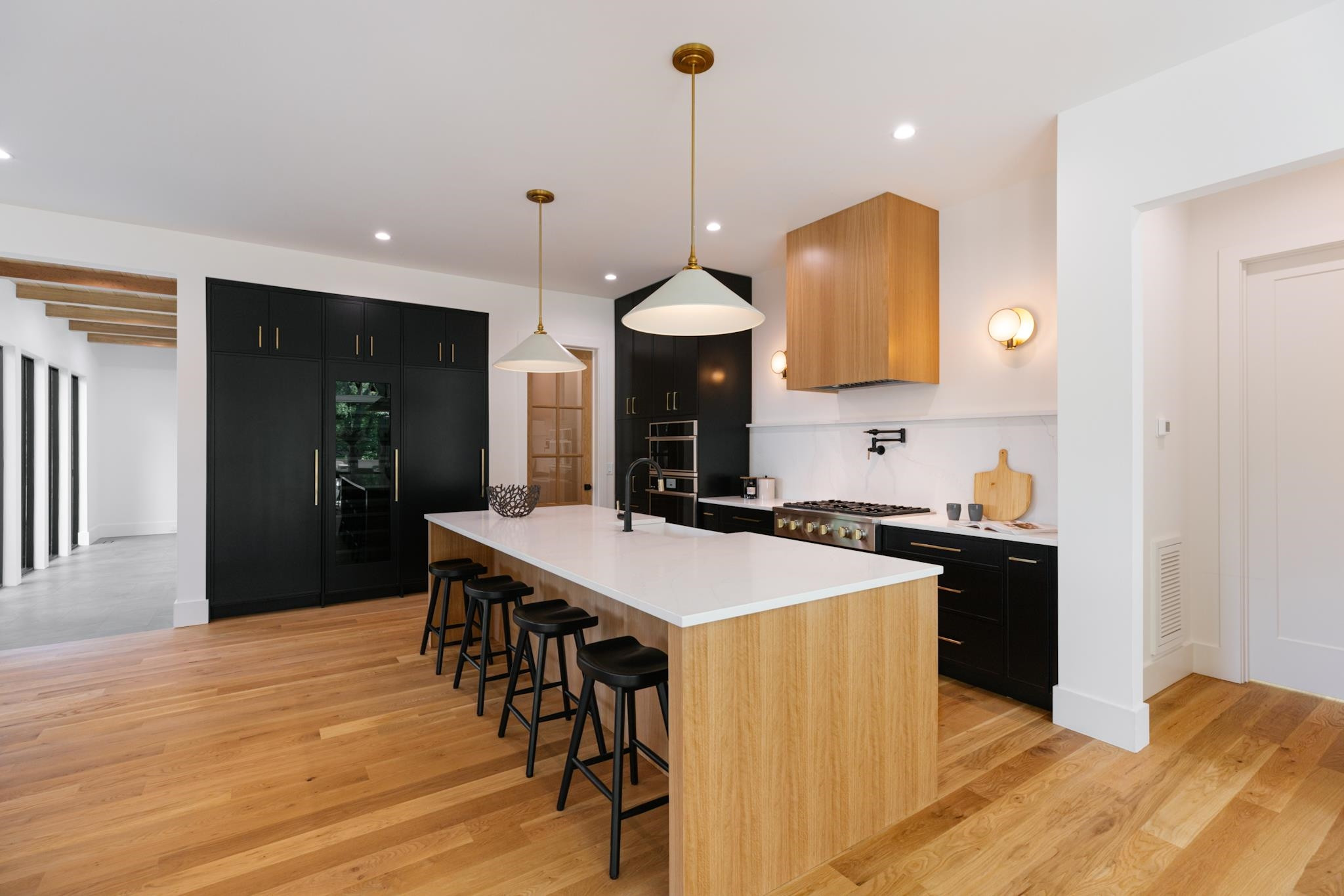 807 Chamberlain Street Raleigh, NC 27607 - Photo 5 of 40 a kitchen with a table chairs sink and refrigerator